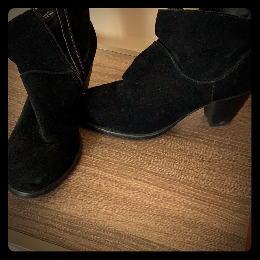 Steve Madden black high heeled boots.